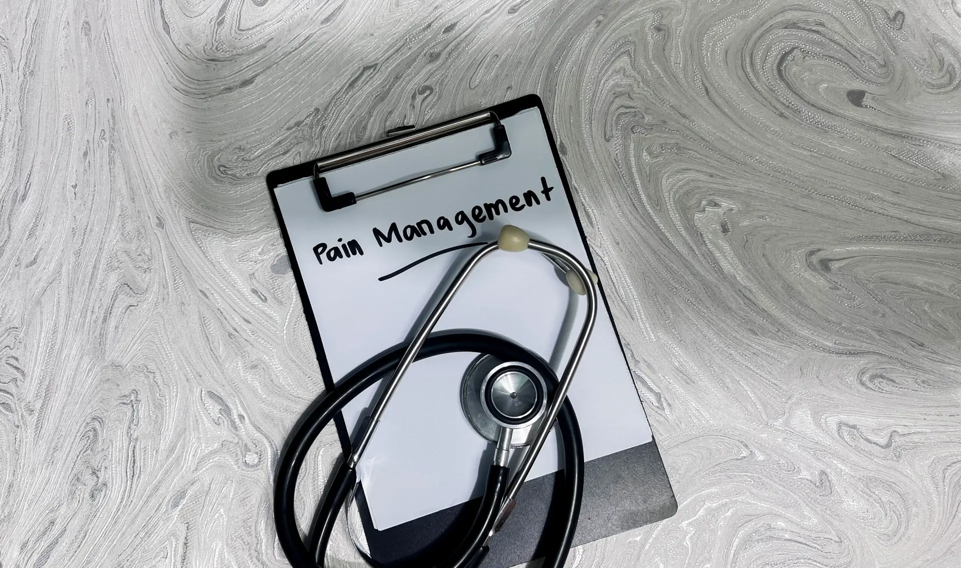 Concept of Pain Management write on paperwork isolated on wooden background.