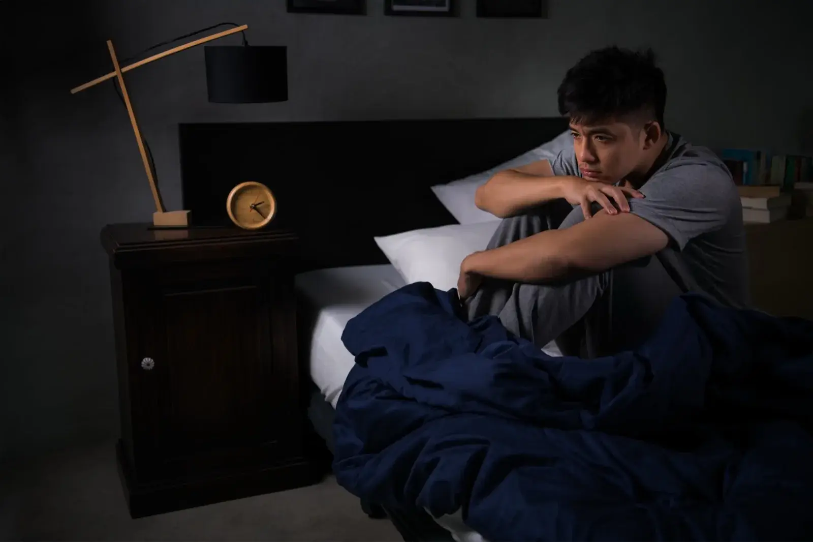 Man lying awake at night with insomnia