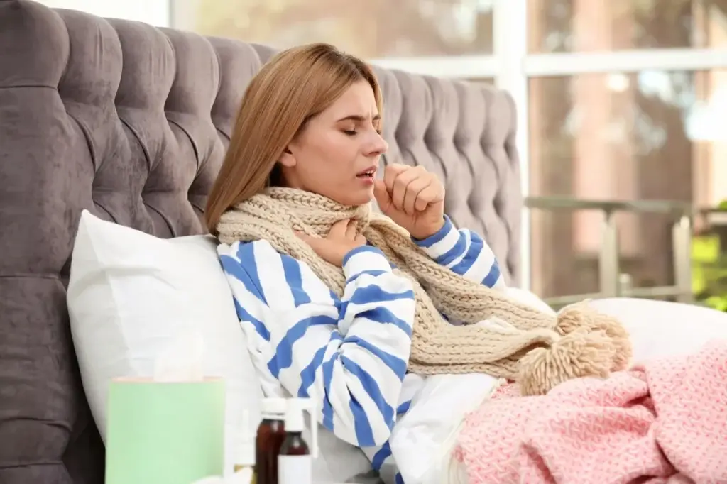 Woman resting in bed while recovering from illness